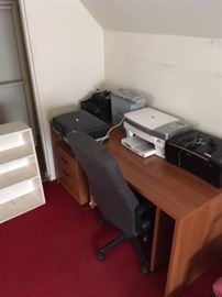 old typewriters, newer printers, another desk
