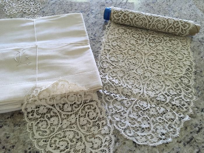 A sample of the antique linen bed sheets  (very heavy linen), table runners, dresser scarfs and doilies.