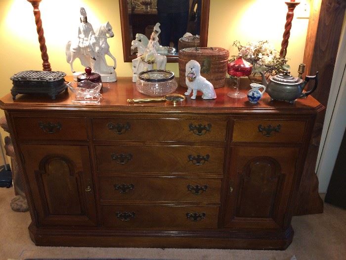 Breakfront/buffet; Staffordshire man on horse and woman on horse; antique tea set in basket.