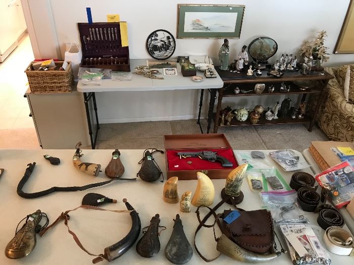 Various gun powder flasks and horns! Scrimshaw pieces. Military medals and Russian belts with buckles and misc different military buckles.