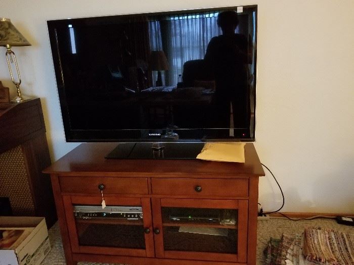 50" flat screen TV, DVD/VCR player/recorder, TV stand