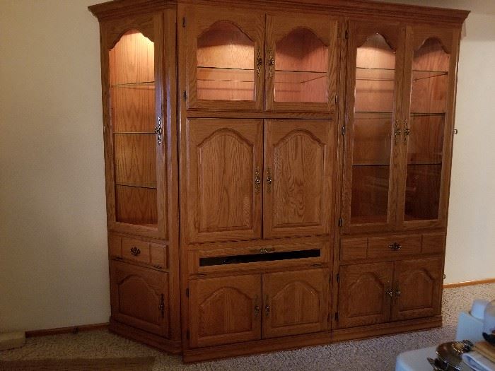 solid wood entertainment center with curio cabinets lighted glass via hinges
