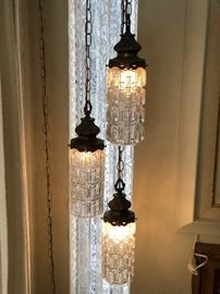 Look at this glass and brass Mid Century corner lamp