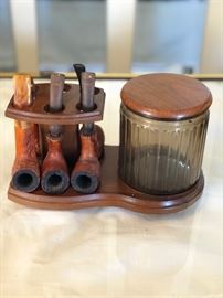 Antique set of 5 pipes in display