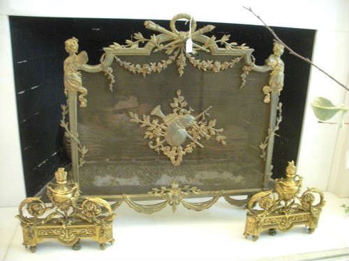 Very ornate and decorative cast brass fireplace screen and andirons.  
