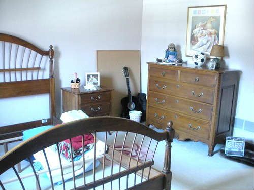 3 bedrooms include dressers, beds, lamps, framed artwork and small furniture.