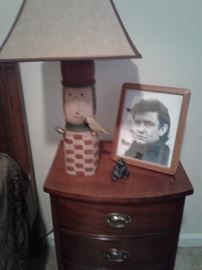 The other nightstand, folkart lamp and an autographed picture of Johnny Cash