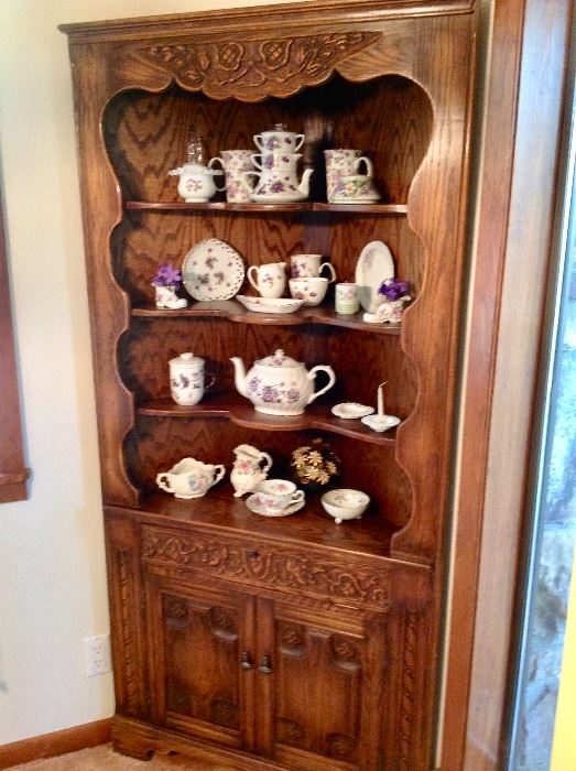 Circa Late 1800's Hand Carved Corner Curio with lots of pretty collectibles.