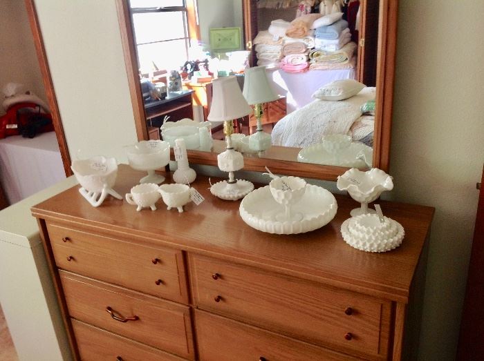 Milk Glass and some Fenton Glass sitting on a Mid-Century Dresser/Mirror