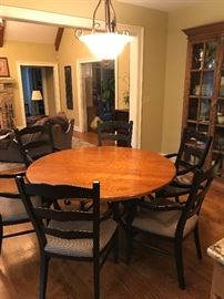 Arhaus 60” round oak table with iron base. Arhaus 6 Canyon Lake arm chairs 