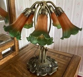 There are 2 of these 6 flower Tiffany-style lamps