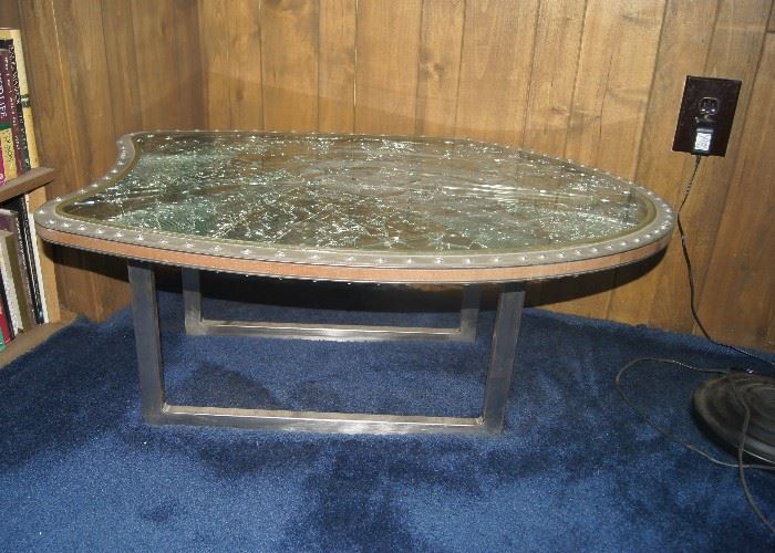 Unusual coffee table made for airplane window.  Very heavy.  Item #036