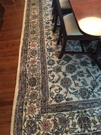 19. Cream Blue and Rust Handknotted Wool Rug (12'x 9')