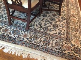 19. Cream Blue and Rust Handknotted Wool Rug (12'x 9')