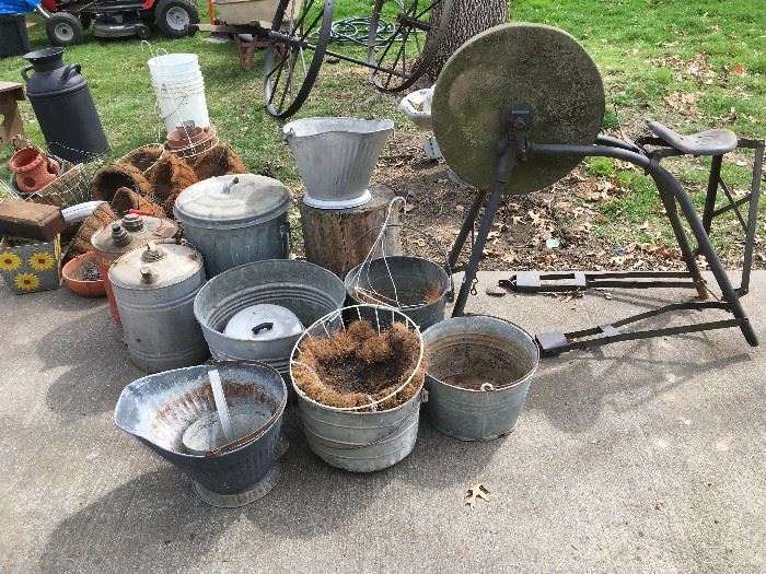 galvanized bucket assortment and stone grinder