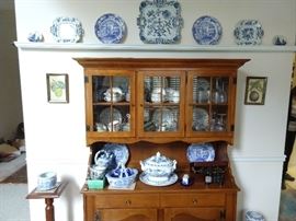 Vintage Ethan Allen cherry hutch, with collection of Blue Danube porcelain.
