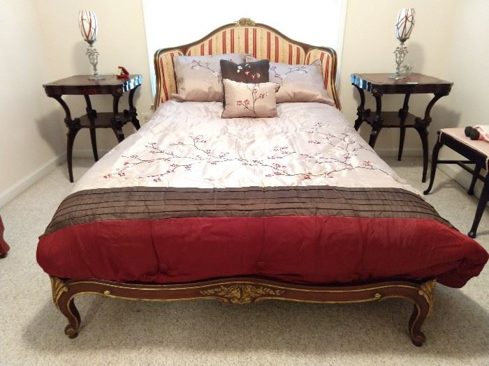 Gorgeous antique carved/gilt wood French bed, with upholstered headboard, pair of 1930's mahogany end tables, with tooled red leather inserts.