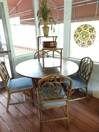 Vintage bamboo round table with four matching side chairs, topped by a vintage Heywood Wakefield bamboo end table.  