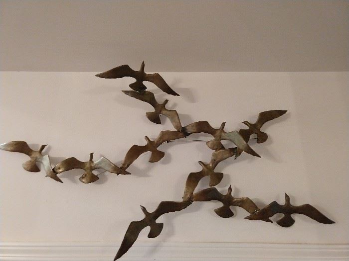 Vintage 11-Dove Peace offering from a Trump Hotel property - riiiiiiiight!                                                               
Actually, it's a signed brutalist brass wall hanging, by Bijan.