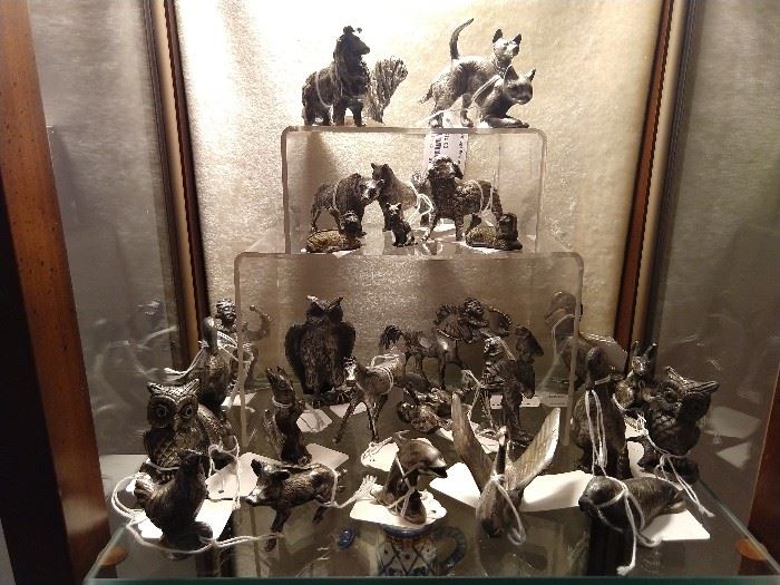 Miniature pewter collection of animals and figurines.