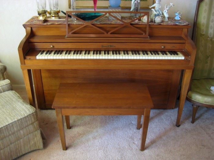 Henry F. Miller Spinet upright acoustic piano with matching bench, medium brown walnut finish 