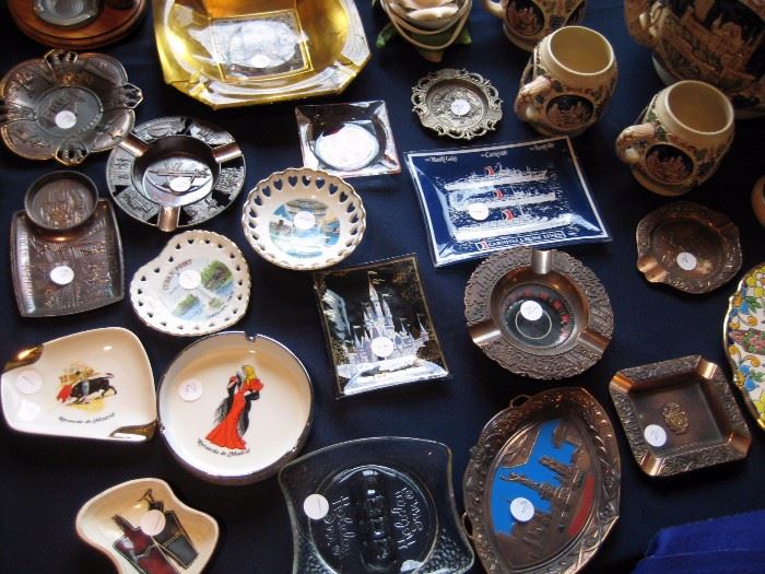 Collection of vintage souvenir ashtrays. 