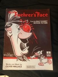 Donald duck pelting Adolph Hitler with a tomato . . .welcome to war era Disney.  $20-