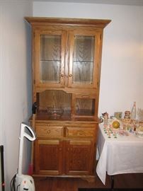 China cabinet, brooms and vacuums