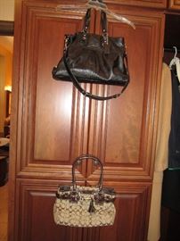Many Coach purses, and huge belt collection