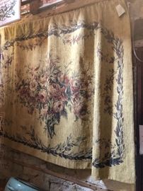 Tapestry with rod, finials and tassels.