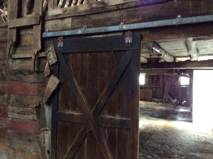 One of 3 barn doors on antique sliders