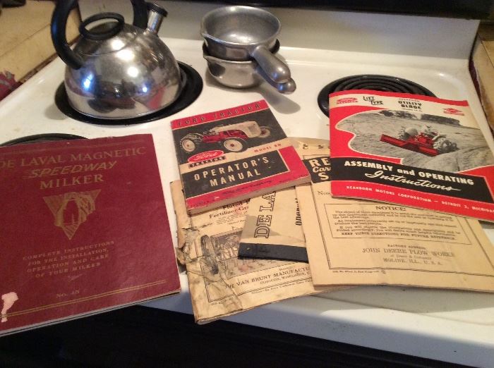 Several antique farm equipment manuals