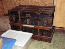 antique steamer trunk with vintage clothing