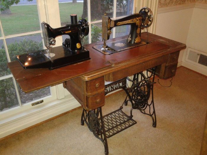 Antique Singer Sewing machine with iron stand.