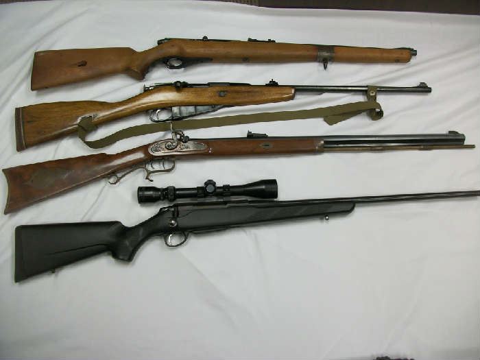 4 of the 9 long guns, all in good to excellent condition