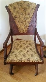 Antique upholstered rocking chair 