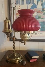 Antique brass student lamp with red glass shade