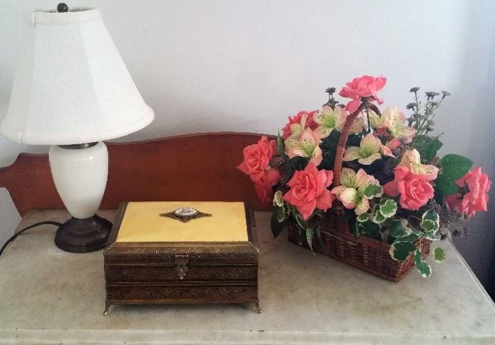 Floral arrangement, brass jewelry box, touch lamp