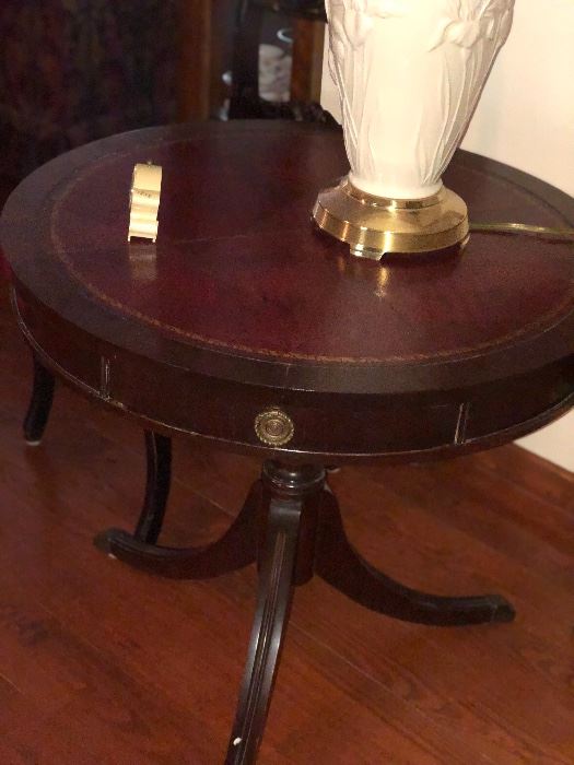 Round leather top mahogany table