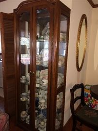 Curio cabinet full of collectibles 