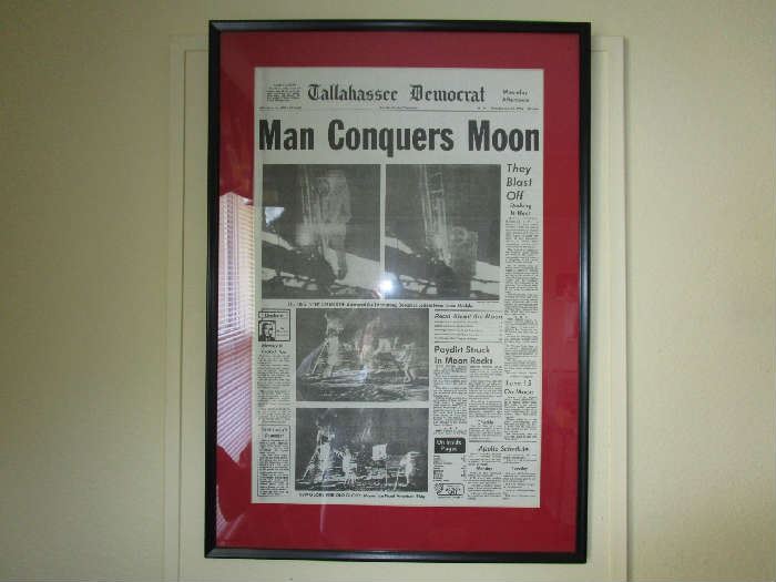 Framed Tallahassee Democrat newspaper of the Moon landing.