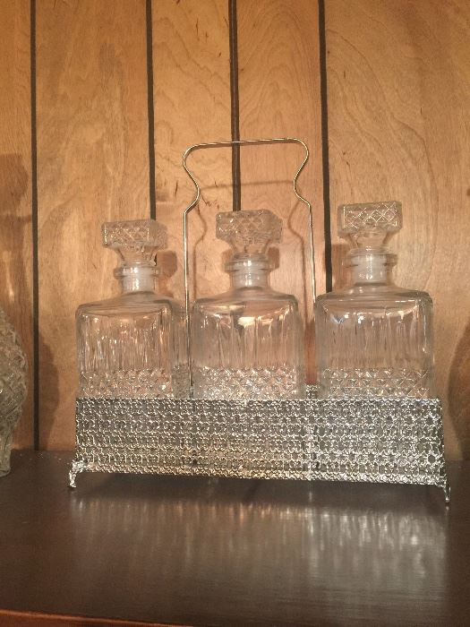 Liquor decanters in silver rack