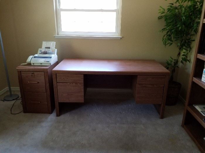 wooden desk and file cabinet
