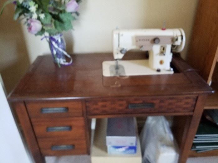 Vintage Singer sewing machine and table. Newer sewing machine below