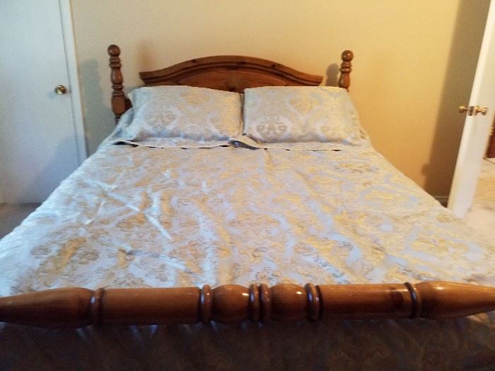 Queen sized wooden frame bed with almost-new mattress and box spring