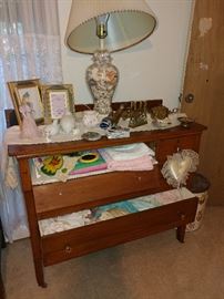 antique dresser, brass, doves, baby clothes, vintage, baby blankets