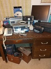 office desk, vintage electronics, computer monitor, camera cases, camcorder 8mm