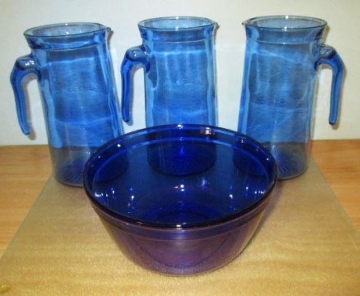 Blue glass pitchers and bowl