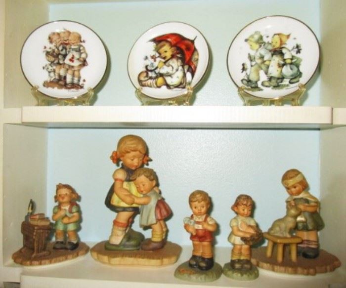 Hummel figurines and small plates