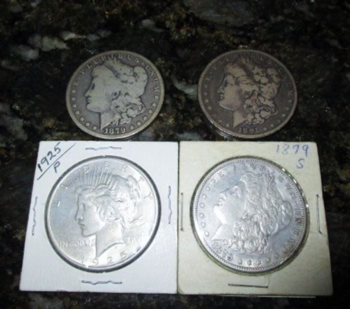 Three 1800's and one 1925 silver dollar coins